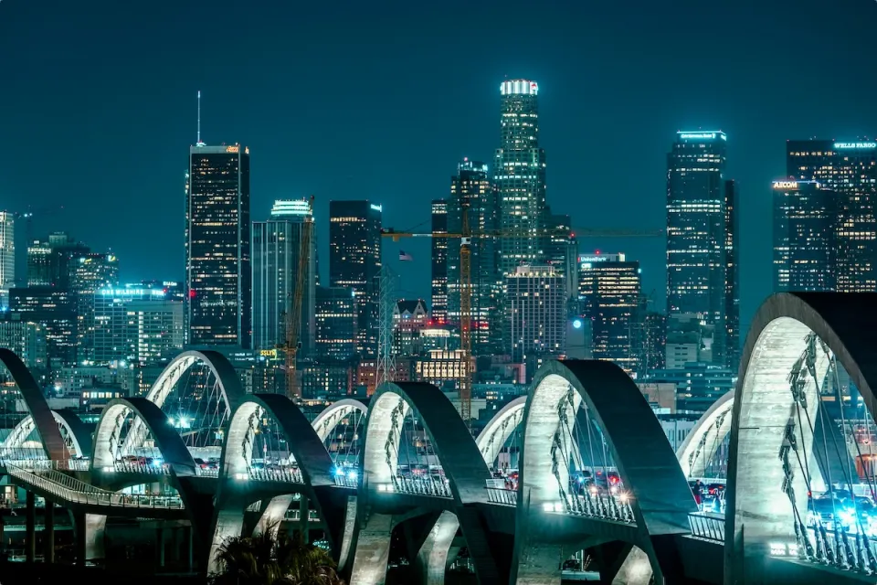 Nighttime view of downtown Los Angeles through arches of new 6th Street Viaduct.
